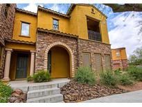 Charming multi-story home featuring stone accents, a cozy balcony, and inviting curb appeal at 20750 N 87Th St # 2115, Scottsdale, AZ 85255