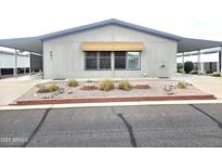 Charming single-story home featuring covered parking, well-maintained landscaping, and easy street access at 2400 E Baseline Ave # 201, Apache Junction, AZ 85119
