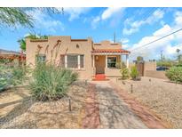 Charming single-story home featuring a well-maintained yard and inviting curb appeal at 2546 N 9Th St, Phoenix, AZ 85006