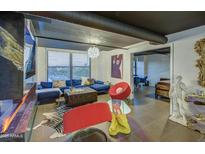 Modern living room with vibrant decor, stylish furnishings, and unique architectural details at 535 W Thomas Rd # 513, Phoenix, AZ 85013