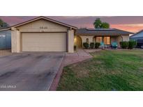 Charming single-Gathering home featuring a well-maintained lawn and a two-car garage at 5529 W Villa Maria Dr, Glendale, AZ 85308