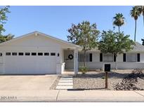 Charming single-story home with a well-manicured yard, a two-car garage, and inviting curb appeal at 694 W Park Ave, Chandler, AZ 85225