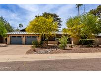 Charming single-story home with desert landscaping and a spacious two-car garage and sidewalk at 7202 N 16Th Dr, Phoenix, AZ 85021