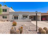 Charming single-story home with desert landscaping and a covered parking area at 7736 E Rancho Vista Dr, Scottsdale, AZ 85251