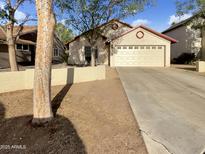 Charming single-Gathering home featuring a two-car garage and a well-maintained front yard at 10242 N 66Th Ave, Glendale, AZ 85302