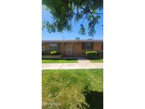 Charming home featuring a well-manicured lawn and lovely curb appeal at 10582 W Oakmont Dr, Sun City, AZ 85351