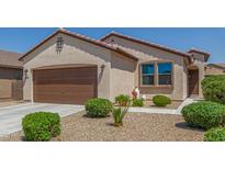 Charming single-Gathering home featuring a two-car garage and desert landscaping at 18388 W Ida Ln, Surprise, AZ 85387