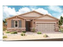 Charming single-story home with a two-car garage, neutral stucco, and stone accents at 40503 W Rio Grande Dr, Maricopa, AZ 85138