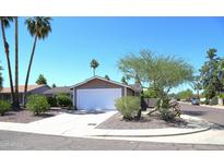 Charming single-story home with a well-maintained yard and a two-car garage at 6920 E Beverly Ln, Scottsdale, AZ 85254