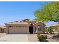 Charming single-story home with a tile roof, desert landscaping, and a two-car garage, exuding curb appeal at 17141 E Rockwood Dr, Fountain Hills, AZ 85268