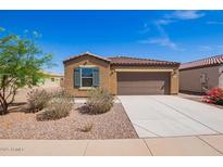 Charming single-story home with low maintenance landscaping and a two-car garage at 1762 E Elegante Dr, Casa Grande, AZ 85122