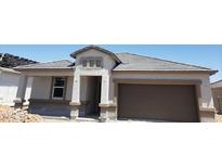 New construction home featuring a two-car garage and neutral-tone exterior with well defined lines at 18812 E Bruno Dr, Gold Canyon, AZ 85118