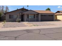 Charming single-story home with gravel landscaping and a two-car garage at 2179 E Palmcroft Dr, Tempe, AZ 85282