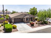 Well maintained single-Gathering home with a beautiful landscaped front yard and a two car garage at 2507 E Eleana Ln, Gilbert, AZ 85298