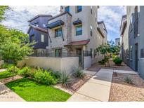 Beautiful home exterior with manicured lawn and garden, plus inviting walkway at 300 N Gila Springs Blvd # 181, Chandler, AZ 85226