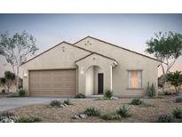 Inviting single-story home featuring a two-car garage and desert landscaping in a neutral color palette at 42945 W Palo Amarillo Rd, Maricopa, AZ 85138