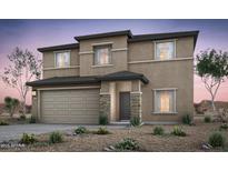 Two story home featuring a two car garage, stucco finish, and stone accents at 42950 W Palo Amarillo Rd, Maricopa, AZ 85138
