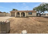 Charming single-story home with desert landscaping and arched entryways at 5918 S Parkside Dr, Tempe, AZ 85283