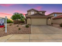 Charming two-story home with a well-maintained front yard and neutral-toned facade at 864 S 223Rd Ln, Buckeye, AZ 85326