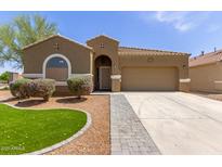 Charming home featuring desert landscaping, paver driveway, and a neutral color palette at 871 E Melanie St, San Tan Valley, AZ 85140