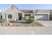 Charming single-story home with a tidy front yard and two-car garage at 925 E Wagoner Rd, Phoenix, AZ 85022