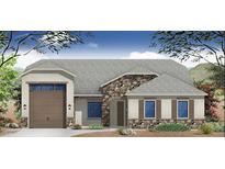 Charming single-story home with stone accents, neutral color palette, and a two-car garage at 17309 W Puget Ave, Waddell, AZ 85355