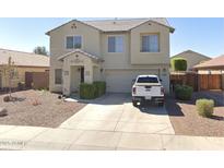 Charming two-story home featuring manicured landscaping and an attached two-car garage at 18629 W Fulton St, Goodyear, AZ 85338