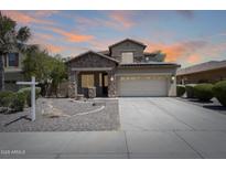 Charming two-story home boasts a stone facade, covered porch, and well-maintained landscaping at 2762 E Clifton Ave, Gilbert, AZ 85295