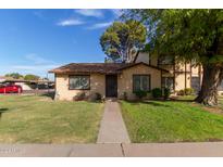 Charming single-story home with a well-maintained lawn and mature shade trees at 6120 N 30Th Ave, Phoenix, AZ 85017