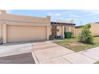 Charming single-story home featuring a two-car garage and mature landscaping in a well-kept front yard at 6219 N 22Nd Dr, Phoenix, AZ 85015