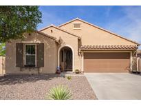 Charming single-story home with a well-maintained desert-landscaped yard and an attached two-car garage at 6482 S Claiborne Ave, Gilbert, AZ 85298