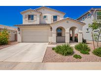 Beautiful two-story home featuring a two car garage, manicured front yard and inviting front porch at 10956 E Thunderbolt Ave, Mesa, AZ 85212