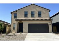 Inviting two-story home with a two car garage and neat landscaping at 13282 E Verbina Ln, Florence, AZ 85132