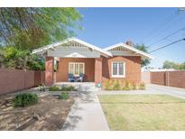 Charming brick home with manicured lawn, sidewalk, and lovely exterior at 1650 N 10Th St, Phoenix, AZ 85006