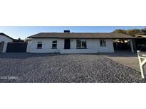 Charming single-story home with a freshly painted exterior and minimalist landscaping at 1720 W Michigan Ave, Phoenix, AZ 85023