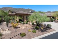 Beautiful single-story home featuring desert landscaping with mountain views at 1958 W Legends Way, Anthem, AZ 85086