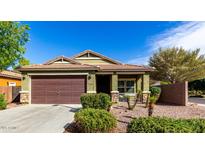 Charming single-story home with a two-car garage and well-manicured landscaping in a suburban neighborhood at 2597 E Hickory St, Gilbert, AZ 85298