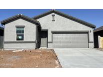 Charming single-Gathering home with a two-car garage and a well-manicured lawn, perfect for suburban living at 29815 N Oak Dr, Florence, AZ 85132