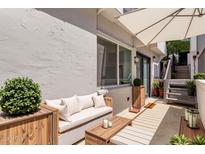 Inviting patio features comfortable seating, shade, and steps to upper level at 3416 N 44Th St # 70, Phoenix, AZ 85018