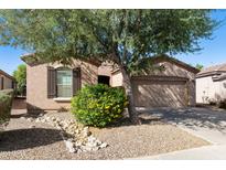 Charming single-story home with a well-manicured xeriscaped front yard and inviting curb appeal at 4245 E Ficus Way, Gilbert, AZ 85298
