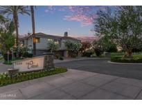 Inviting exterior view of a contemporary townhome with lush landscaping and a beautiful desert setting at 7222 E Gainey Ranch Rd # 245, Scottsdale, AZ 85258