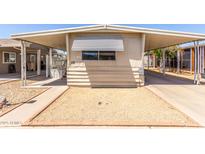 Charming single-story home with a covered carport and front gravel yard at 11411 N 91St Ave # 28, Peoria, AZ 85345