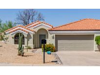 Charming single-story home with a tile roof, desert landscaping, and an inviting entrance at 14239 N Edgeworth Dr # A, Fountain Hills, AZ 85268