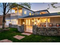 Elegant two-story home with stone accents, covered porch, well-lit with manicured lawn, and a warm inviting ambiance at 3824 N 50Th Pl, Phoenix, AZ 85018