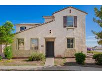 Charming two-story home featuring a desert-themed landscape and neutral color palette at 5104 W Fulton St, Phoenix, AZ 85043