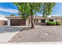 Charming single-story home featuring a well-maintained front yard and two-car garage at 560 E San Pedro Ave, Gilbert, AZ 85234