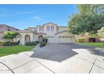 Stunning two-story home with a three-car garage, a spacious driveway, and well-maintained landscaping at 5726 W Park View Ln, Glendale, AZ 85310