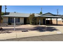 Charming single story home with desert landscaping, covered parking, and updated features at 6543 E Palm Ln, Scottsdale, AZ 85257