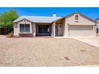 Charming single-story home with stucco siding, well-maintained landscaping, and a two-car garage at 722 W Topeka Dr, Phoenix, AZ 85027