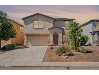 Inviting two-story home featuring a neutral color scheme and a spacious two car garage at 950 E Kelsi Ave, San Tan Valley, AZ 85140